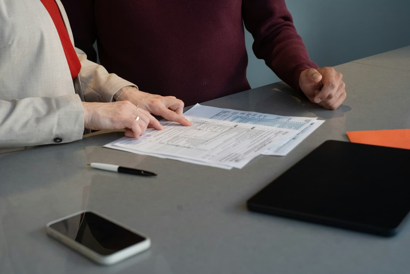 Compliance officer reviewing employment documentation